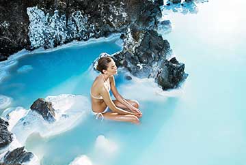 A tourist at Blue Lagoon, a geothermal spa in Iceland