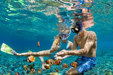 Couple snorkeling in Galapagos, Latin America tour