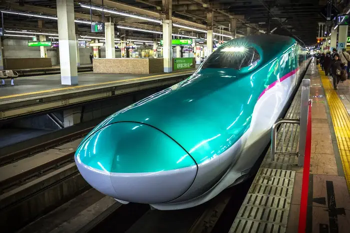 The Shinkansen train arriving to train station in Tokyo, Japan
