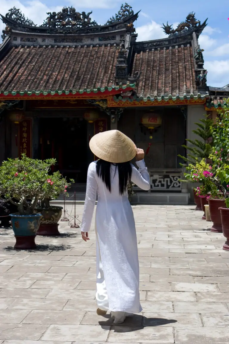 Woman wearing Ao-Dai outside in Vietnam